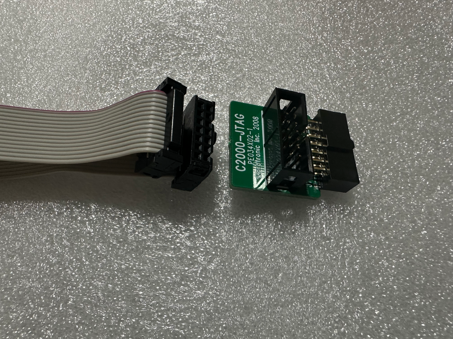 One 14 pins ribbon cable and C2000-JTAG adapter(PN: PE034X02)